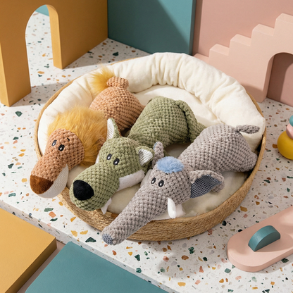Assorted plush dog chew toys in a woven pet bed, including a lion, wolf, alligator, and two elephants.