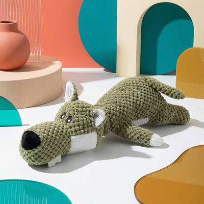Green knitted crocodile plush dog chew toy with white belly and ears, black nose, and small eyes.